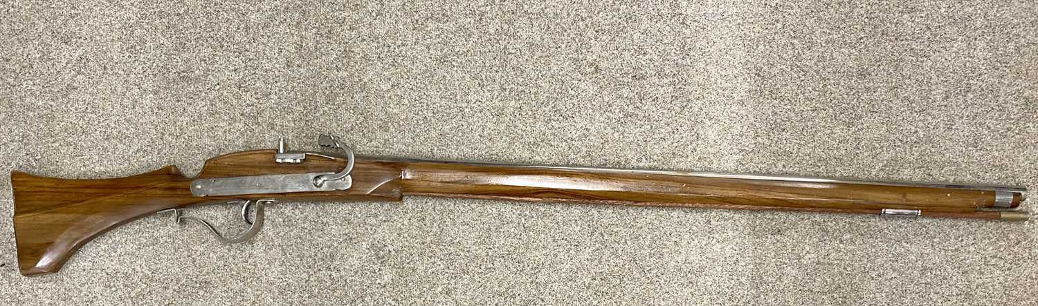 REPLICA MATCHLOCK RIFLE, 108cms cylindrical barrel, with ramrod Provenance: deceased estate Ynys