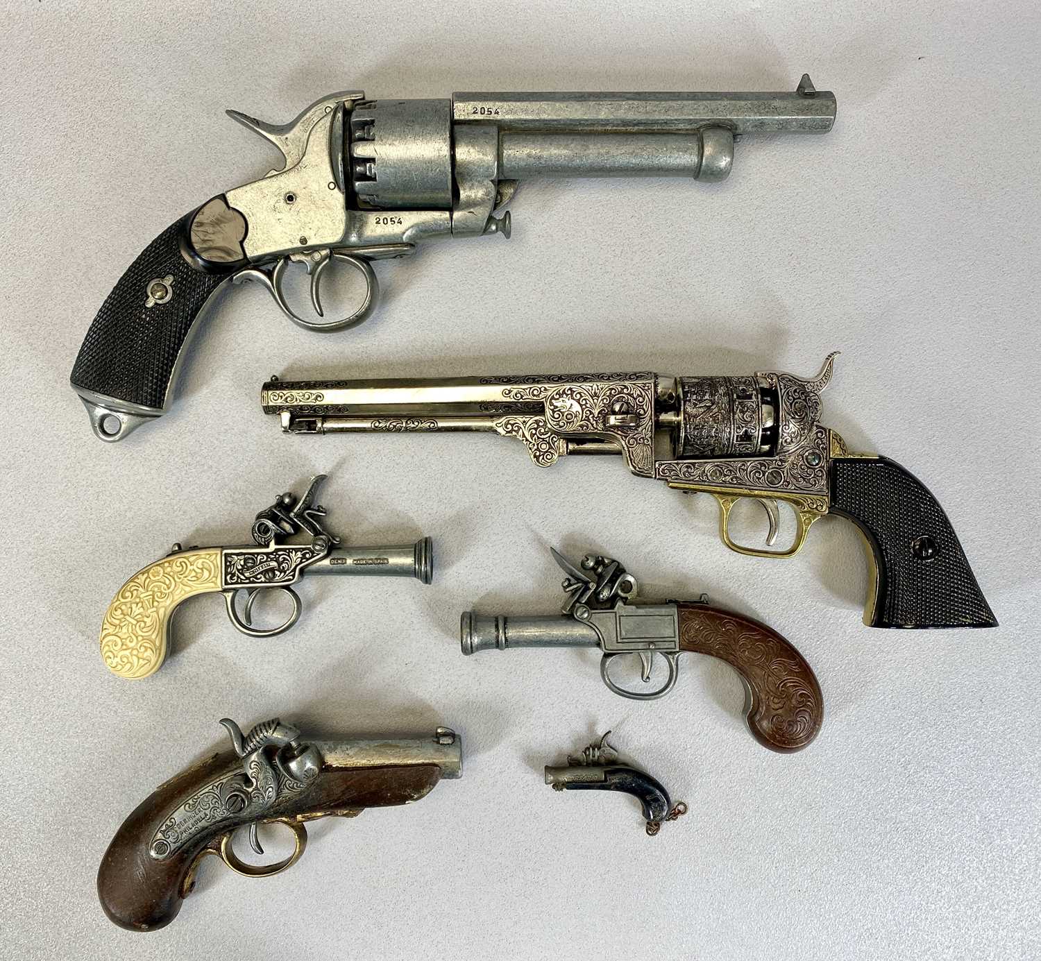 FIVE REPLICA PISTOLS, Spanish 9-shot revolver, 37cms L, Deringer, 17cms L, Spanish Griffin pocket