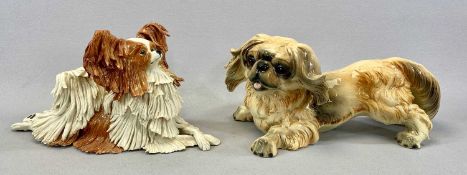 TWO CERAMIC DOG FIGURES comprising Eve Pearce Papillon, signed to base, 30.5cms (l) and a Goebel