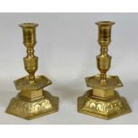 PAIR OF YSTAD METALL SWEDISH CAST BRASS CANDLESTICKS, with hexagonal mid column drip trays and domed