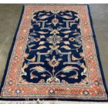 MAHAL RUG, brightly coloured blue ground with terracotta border, large floral design throughout, 2.