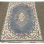 CHINESE WASHED RUG, blue ground with floral pattern, 183 x 121cms Provenance: private collection