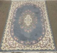 CHINESE WASHED RUG, blue ground with floral pattern, 183 x 121cms Provenance: private collection