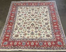 FINE KASHAN RUG, cream ground with wide red border, other multiple borders and floral design
