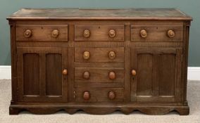 VICTORIAN OAK DRESSER BASE having three drawers over three blind centre drawers and flanking