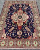 TABRIZ RUG, striking blue and red ground with intrinsic central panel pattern and continuous
