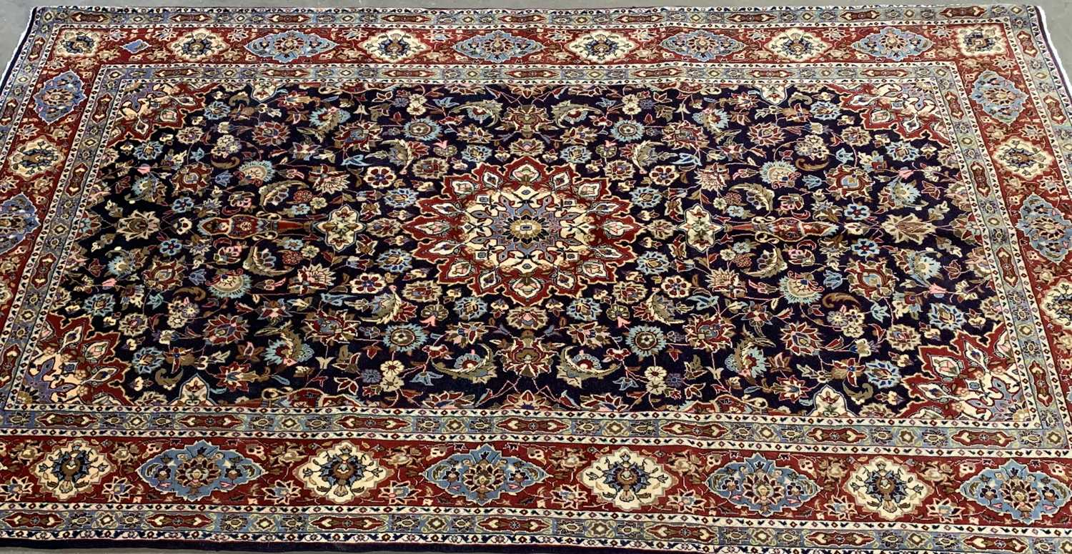 FINE KASHAN RUG, navy blue and burgundy ground, repeating diamond border with sunburst central - Image 2 of 3