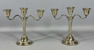 PAIR OF ELIZABETH II SILVER CANDELABRA two branches, three sconces, with removable nozzles, circular