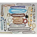 INTERESTING GROUP OF COSTUME JEWELLERY, including Murano and other glass bead necklaces, gold tone