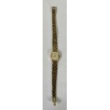 MARVIN 9CT GOLD LADIES INTEGRAL BRACELET WRISTWATCH having an oval dial, baton markers, quartz