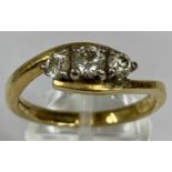 GOLD THREE STONE DIAMOND CROSSOVER RING, size T, 5.3gms Provenance: deceased estate Carmarthenshire