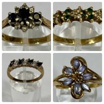 FOUR 9CT GOLD STONE SET RINGS comprising emerald and diamond chip band, size Q-R, floral blue