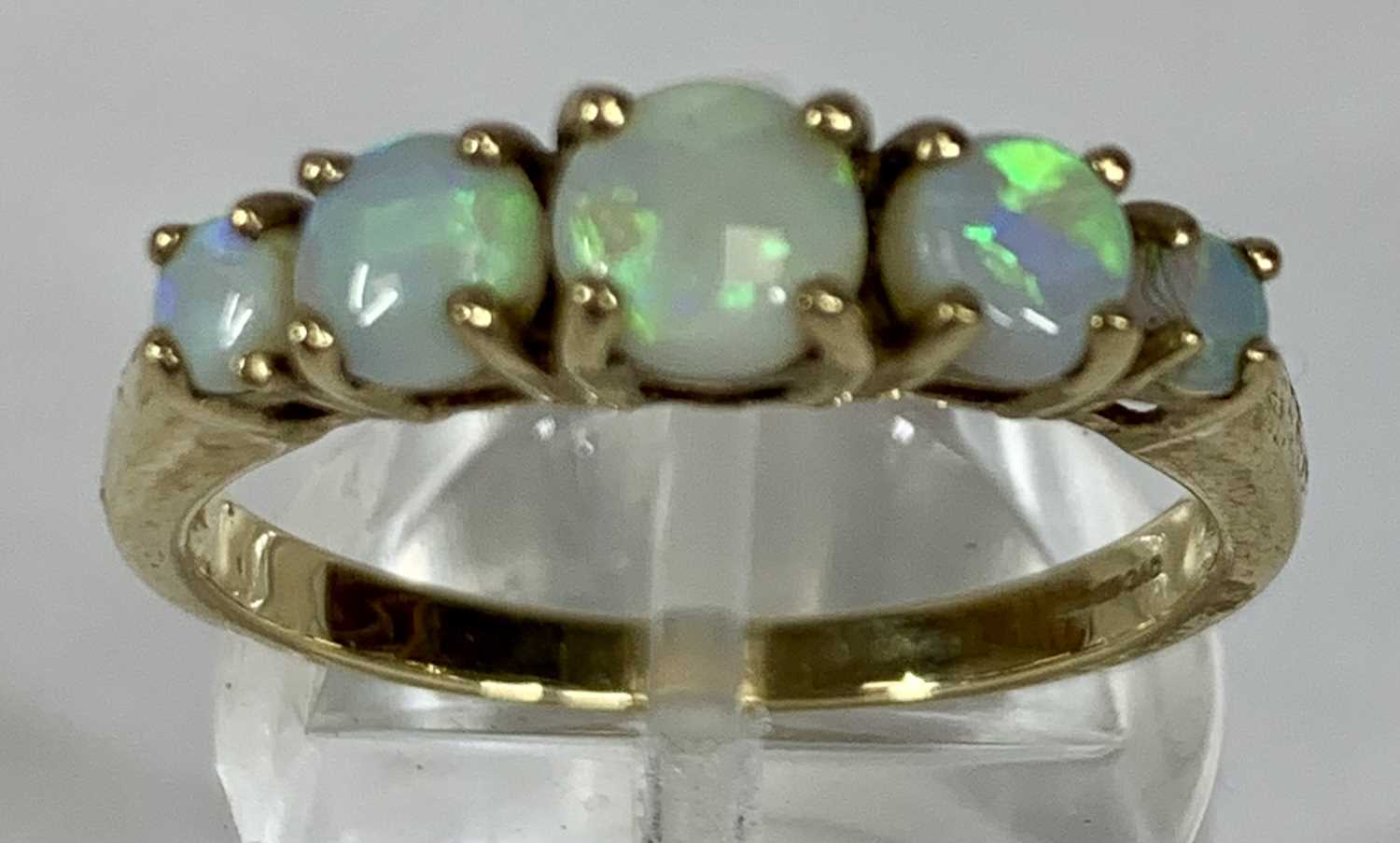 FOUR GOLD/YELLOW METAL RINGS, opal five stone band, size Q, two eternity, size O and K, half - Image 2 of 9