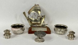 SILVER SALT TRIO, 2.3ozt, believed silver model of a small boat on wooden plinth and a pair of white