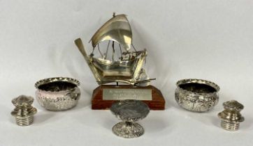 SILVER SALT TRIO, 2.3ozt, believed silver model of a small boat on wooden plinth and a pair of white