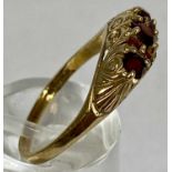 9CT GOLD RING, set with band of seven rubies, with chased mount, size O, 2.7gms Provenance: