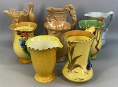 BURLEIGH WARE, a group of eight jugs, some brightly coloured and with animal handles, 25cms (h)