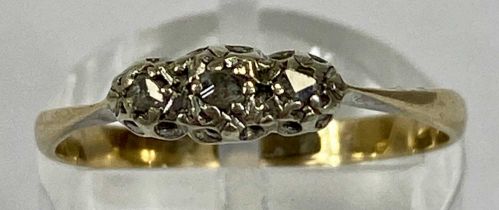 9CT GOLD RING, set with a band of three small diamonds, size N, 1.3gms Provenance: private