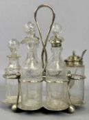 EPNS CRUET FRAME, with six glass bottles/jars, etched decoration, 26cms (h) Provenance: private
