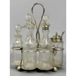 EPNS CRUET FRAME, with six glass bottles/jars, etched decoration, 26cms (h) Provenance: private