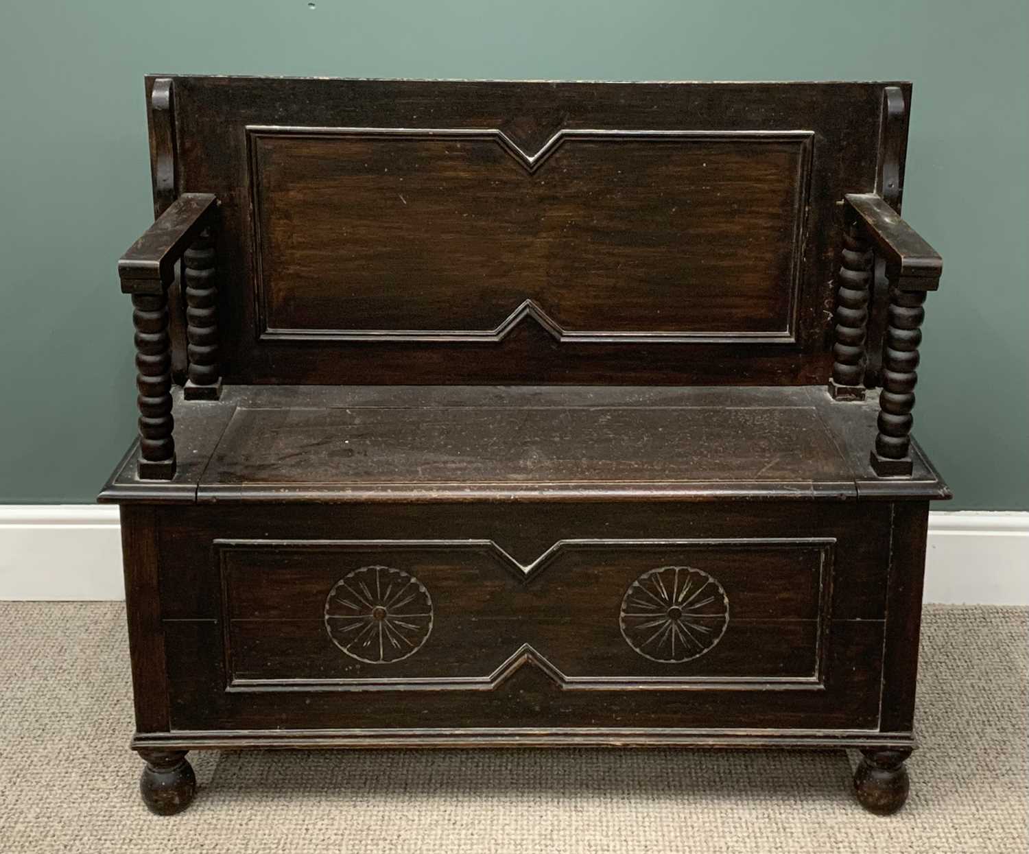 POLISHED & CARVED MONK'S BENCH, 80 (h) x 106 (w) x 46cms (d) Provenance: private collection Gwynedd