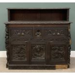 HEAVILY CARVED SIDEBOARD circa 1900, ebonised with heavy carved detail, the base with three deep