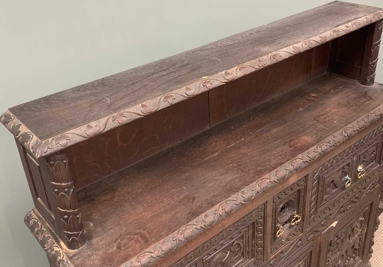 HEAVILY CARVED SIDEBOARD circa 1900, ebonised with heavy carved detail, the base with three deep - Image 4 of 7