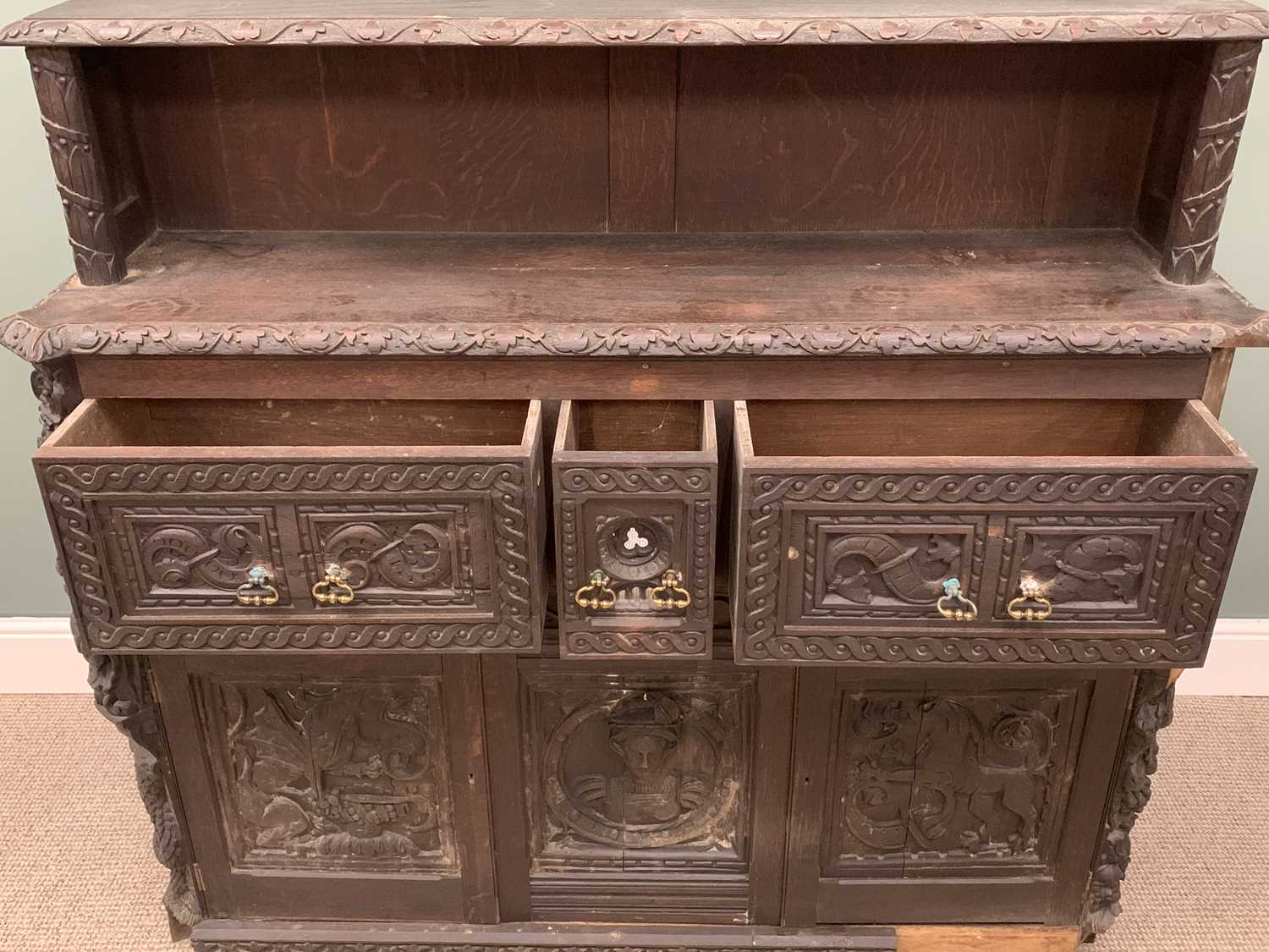 HEAVILY CARVED SIDEBOARD circa 1900, ebonised with heavy carved detail, the base with three deep - Image 5 of 7