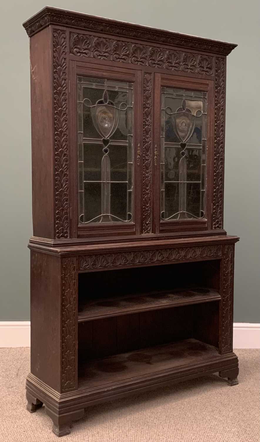 EDWARDIAN CARVED OAK BOOKCASE circa 1900, having an open two shelf base, below elaborately leaded - Image 3 of 5