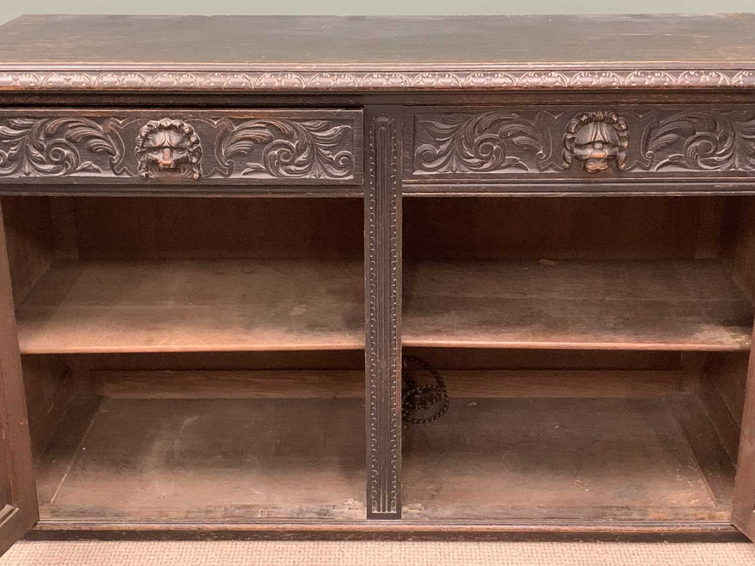 19TH CENTURY SIDEBOARD BASE being ebonised and heavily carved with lion mask detail, two drawers - Image 6 of 6