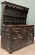 CAERNARFONSHIRE OAK DRESSER, 18th Century and later, two shelf shaped rack over base of three