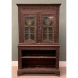 EDWARDIAN CARVED OAK BOOKCASE circa 1900, having an open two shelf base, below elaborately leaded