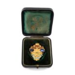 A RARE GOLD & ENAMEL RUGBY UNION MEDALLION awarded to Welsh International player Percy Bush (