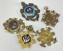 FIVE MASONIC MEDALS four in hallmarked 9ct gold of which two are enamel decorated, the other in