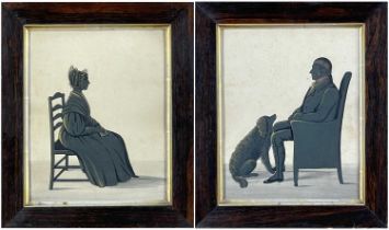 PAIR OF ANTIQUE SILHOUETTES, a seated lady and a seated gentleman with a canine companion, gilt