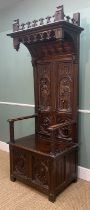 GOTHIC STYLE CARVED OAK HIGH BACK ARMCHAIR, with box seat, decorated in the medieval style with