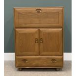 LIGHT ERCOL BUREAU with fall front top over two cupboards doors and a base drawer, 110 (h) x 82 (