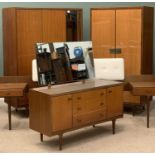 MID-CENTURY TEAK TYPE BEDROOM FURNITURE by Wrighton comprising a fitted wardrobe, 177 (h) x 92 (w) x