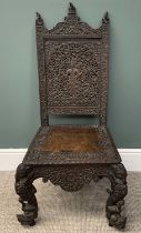 ANGLO-INDIAN ELEPHANT CHAIR profusely carved with huntsman to backrest, elephants to rail, figural