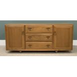 LIGHT ERCOL SIDEBOARD with three central drawers including a cutlery tray, two cupboard doors, on