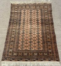 EASTERN RUG with repeating border and pattern, ground red and black, 188 x 125cms Provenance: