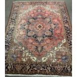LARGE PERSIAN RUG of red ground with repeating border and central multiple diamond section, 345 x