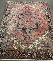 LARGE PERSIAN RUG of red ground with repeating border and central multiple diamond section, 345 x