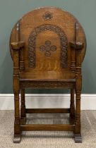 EARLY 20th CENTURY OAK MONK'S BENCH/CHAIR with circular carved top, 74 (h) x 69 (diam) cms