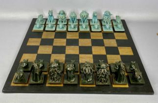 STUDIO POTTERY CHESS SET, modelled as animals, 32 pieces with stained wooden chess board, 61cms²