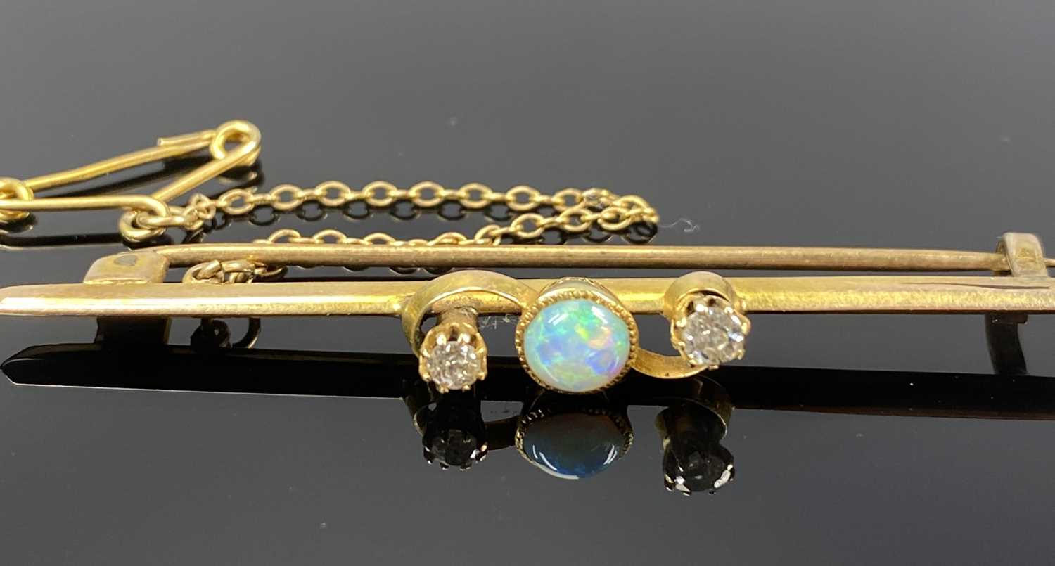 TWO YELLOW METAL BAR BROOCHES, one set with a central opal flanked by four small diamonds, with - Image 2 of 3