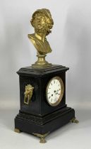 BLACK SLATE MANTEL CLOCK, late 19th century, surmounted with a gilded spelter bust of a Greek