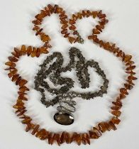 POLISHED AMBER NECKLACE and a smoky topaz and Biwa pearl silver necklace Provenance: private