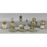 GROUP OF NINE SILVER MOUNTED GLASS DRESSING TABLE JARS & SCENT BOTTLES, 12cms (h) the tallest