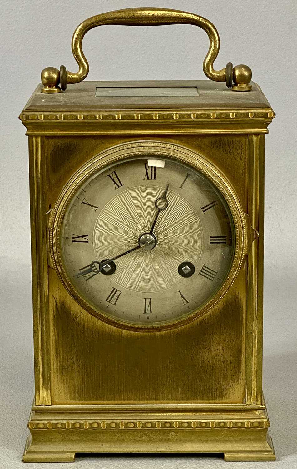 FRENCH GILT BRASS CASED CARRIAGE CLOCK, late 19th century, circular silvered dial with black Roman